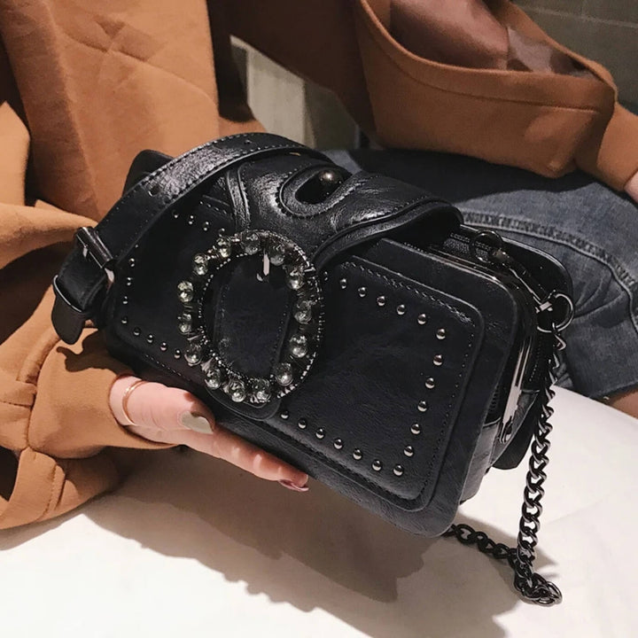 Margheritas Studded Buckle Clutch