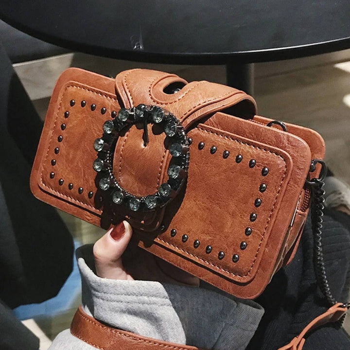 Margheritas Studded Buckle Clutch